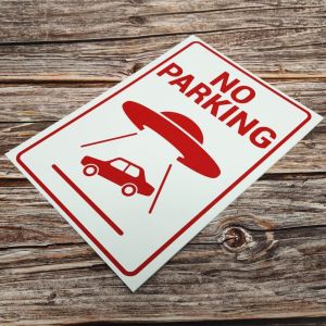 ‘NO PARKING’ White and Red With UFO Abducting Car, Warning Sign. Tough, Durable And Rust-Proof Weatherproof PVC Sign For Outdoor Use, 297MM X 210MM. NO 031